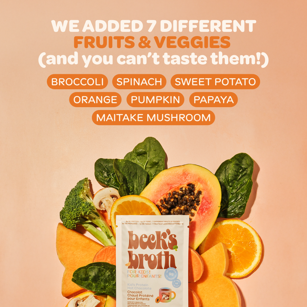 A promotional graphic for Beek's Broth featuring a pouch of chocolate flavored chicken bouillon surrounded by sliced papaya, oranges, broccoli, spinach, and mushrooms on a peach background. Large text at the top reads, 'WE ADDED 7 DIFFERENT FRUITS & VEGGIES (and you can't taste them!)' with orange pill-shaped labels naming the ingredients.